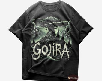 May include: A black t-shirt with a green and white graphic print of a tree with roots and the word "GOJIRA" in a stylized font.