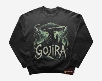 May include: A dark grey sweatshirt with a green graphic of a tree with roots and the word "GOJIRA" in green text.