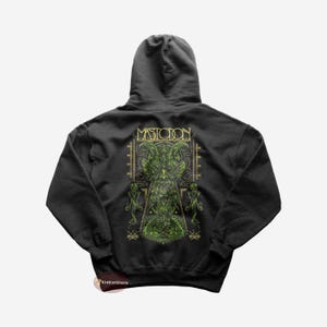 May include: Black hooded sweatshirt with a green and gold graphic print of a creature with horns and the word "MASTODON" on the back.