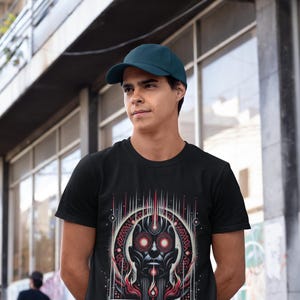 May include: A black t-shirt with a graphic of a stylized face with red eyes and the word "TOOL" printed below. The person wearing the shirt is wearing a dark blue baseball cap.