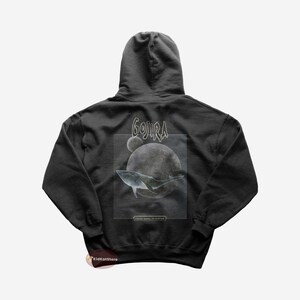 May include: Black hooded sweatshirt with a graphic print of a whale swimming in front of a moon and the text "GOJIRA FROM MARS TO SIRIUS".