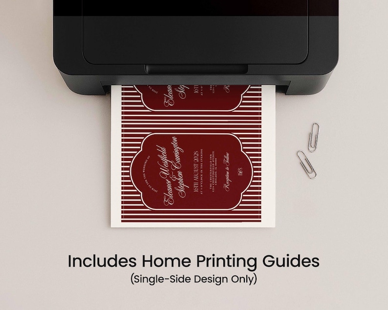 May include: A black printer printing a maroon and white invitation with the text "Eleanor Westfield Stephen Carrington" and "8th August 2025". The invitation has a decorative border and horizontal stripes. Two silver paper clips are on the surface.