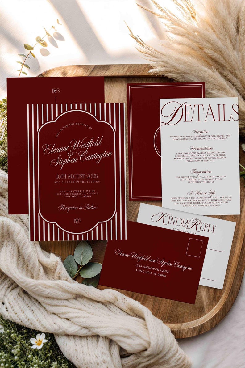May include: Burgundy wedding invitation suite with white text. The main invitation features vertical stripes and the names Eleanor Westfield and Stephen Carrington. Includes details, RSVP, and address cards.