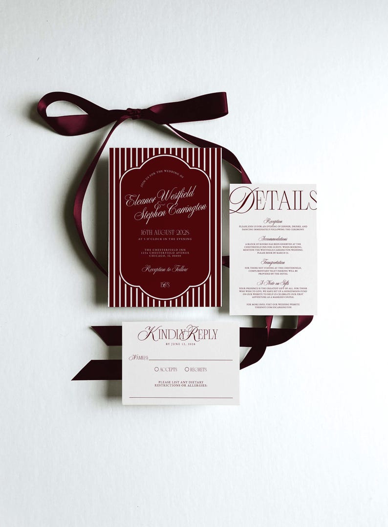 May include: Wedding invitation suite with burgundy and white design. The main invitation card features vertical stripes and elegant script. Additional cards include details and a reply card, all tied with a burgundy ribbon.