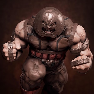 May include: A detailed sculpture of a muscular character in a brown and red costume, with a metal helmet and gauntlets. The figure has an angry expression, with clenched fists and a determined stance. The overall theme is a comic book or fantasy character.