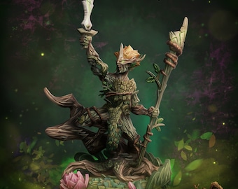 May include: Aurel #360, a green and brown miniature figurine of a tree-like creature holding a sword and a staff. The figurine is standing on a base with a pink flower. The text "Ancient Woodlands Collection" is visible in the bottom right corner of the image.