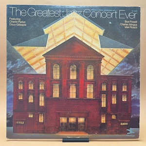 May include: A vintage record album cover featuring a red brick building with a star-shaped roof. The album title is "The Greatest Jazz Concert Ever" and features the names of musicians Charlie Parker, Dizzy Gillespie, Bud Powell, Charles Mingus, and Max Roach.