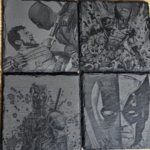 May include: Set of four square slate coasters featuring engraved images of Marvel Comics characters. The designs include Deadpool, Wolverine, and other characters in action poses. The coasters are dark gray with a rough texture.