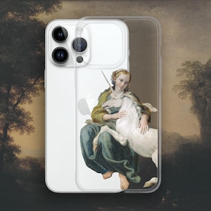 May include: Clear phone case featuring a classical painting of a woman with a white unicorn. The artwork depicts the woman in a green and gold dress, embracing the unicorn. The phone case is designed to fit a smartphone.