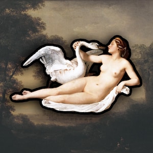 May include: A sticker featuring a classical painting of a nude figure reclining with a swan. The artwork has a black outline and is set against a dark, blurred background reminiscent of a landscape.