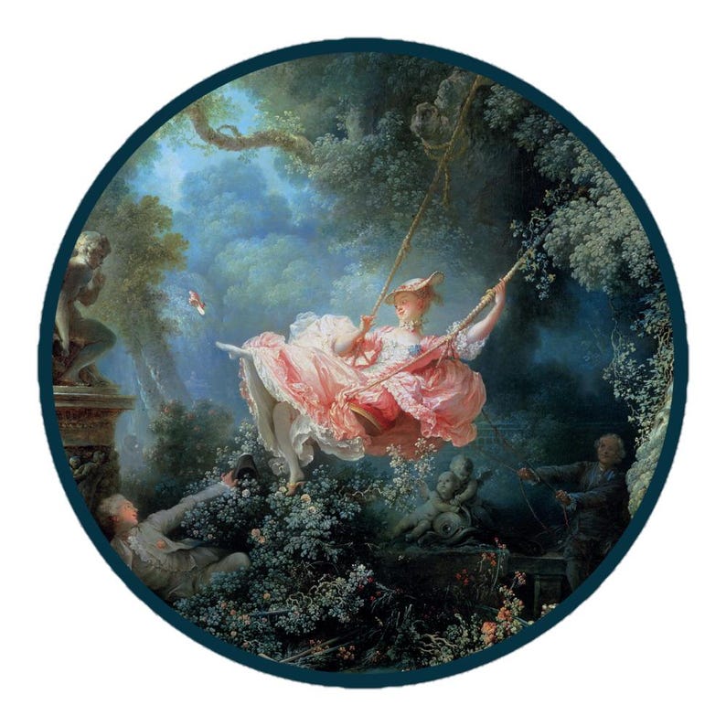 May include: A round print of a Rococo painting depicting a woman on a swing in a lush garden. She wears a pink dress and hat. Other figures are in the background, and a cherub statue is visible. The artwork is framed by a dark blue border.