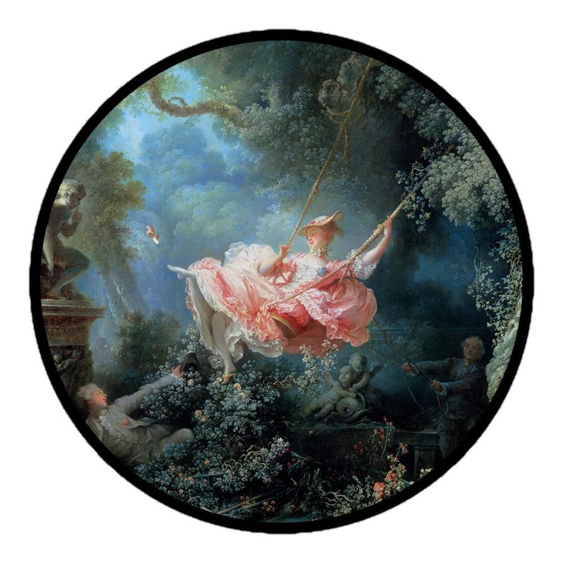 May include: A circular print of a Rococo painting depicting a woman on a swing in a garden. She wears a pink dress and hat. Two men and cherubs are in the background. The artwork is set against a backdrop of lush greenery and a cloudy sky.