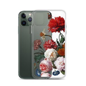 May include: Clear phone case featuring a vibrant floral design with red, white, pink, and orange blooms. The case is shown on a dark green smartphone, offering protection and a stylish aesthetic.