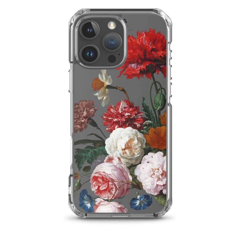 May include: Clear phone case featuring a floral still life design. The artwork showcases a variety of flowers, including red poppies, white roses, and pink blooms, set against a gray background. The case is designed to fit a smartphone.