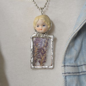 Broken China soft solder Pendant Necklace, Reclaimed Vintage Figurine childs head, purple pressed flowers in glass , handcrafted, Ship FREE