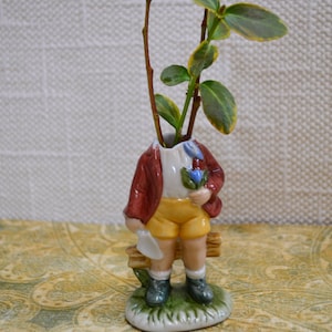 Ceramic upcycled small vintage figurine vase, boy child in shorts with no head. ooak vase, gothic, knickknack conversation piece