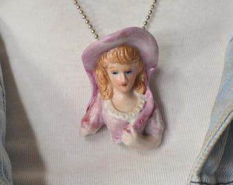 Doll head Pendant Necklace, Recycled ceramic figurine ,pink  dress lady torso , includes FREE pendant