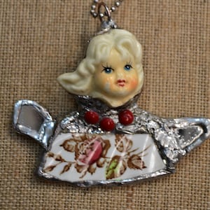 Doll head Necklace , one of a kind,  handcrafted repurposed upcycled broken figurine head and plate shard,wearable art , boho chic necklace