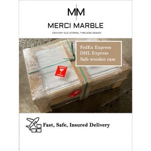 May include: A wooden crate wrapped in clear plastic, secured with green straps, and labeled with "FRAGILE" stickers. The crate features the "MERCI MARBLE" logo and text indicating "Fast, Safe, Insured Delivery."