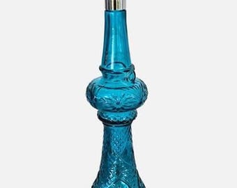 Frasco de perfume vintage AVON em vidro azul turquesa, também conhecido como "Lâmpada de furacão" ou "Frasco do gênio".
