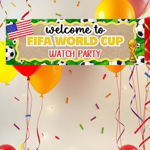 May include: A rectangular banner featuring the text welcome to FIFA WORLD CUP WATCH PARTY, a United States flag, and a gold trophy illustration. The border is decorated with soccer balls on a green background, surrounded by red and yellow balloons.