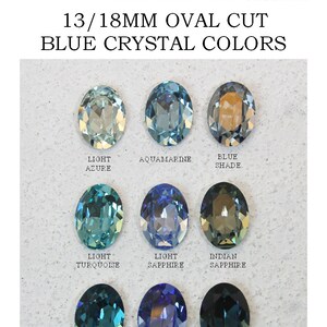 May include: A collection of nine 13/18mm oval cut crystals in various blue shades, labeled as Light Azure, Aquamarine, Blue Shade, Light Turquoise, Light Sapphire, Indian Sapphire, Indicolite, Sapphire, and Montana, arranged in a grid.