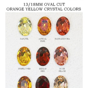 May include: A collection of nine 13/18mm oval cut crystals in orange and yellow shades. The crystals are labeled Janquil, Astral Pink, Padpardscha, Sunflower, Indian Red, Rose Peach, Topaz, Siam (Red), and Light Peach, arranged in a grid.