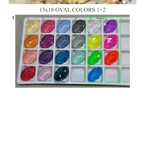 May include: A white plastic tray containing 13x18 oval-shaped cabochons in various colors, labeled with numbers 1 through 22. The text TIMATIBO JEWELRY WITH A SPARK and 13x18 OVAL COLORS 1+2 appear above the tray. A green box highlights neon colors.