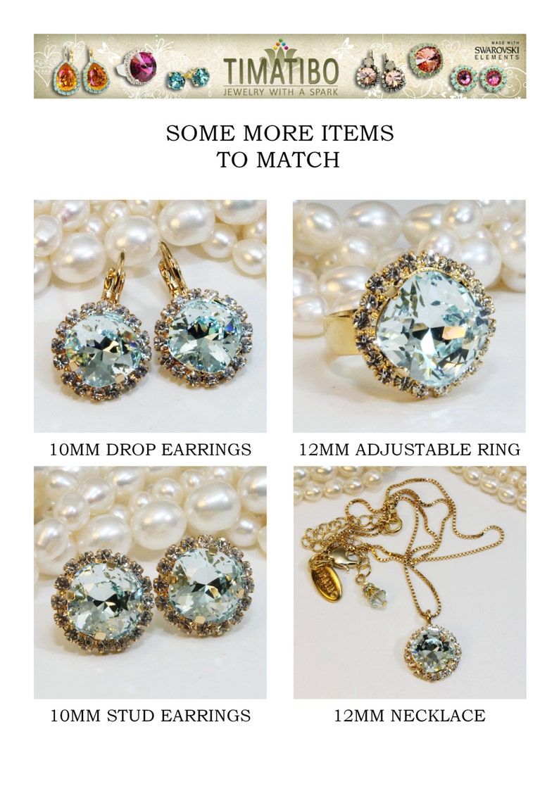 May include: Four pieces of jewellery featuring light blue crystal stones set in gold. The jewellery includes a pair of drop earrings, a pair of stud earrings, a ring, and a necklace. The jewellery is displayed on a background of white pearls.