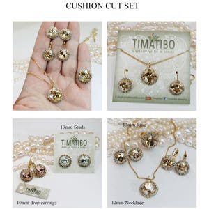 May include: A set of gold-tone jewellery featuring cushion-cut crystals. The set includes a necklace, a ring, a pair of earrings, and a pair of stud earrings. The jewellery is made with Swarovski elements.