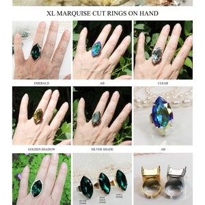 May include: XL Marquise cut rings on hand in various colors and finishes, including emerald, AB, clear, golden shadow, silver shade, and adjustable band.