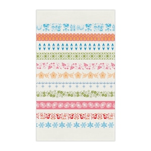May include: A white rectangular kitchen towel with colorful horizontal bands of various patterns. The bands include floral, geometric, and animal designs in shades of blue, orange, pink, and green.