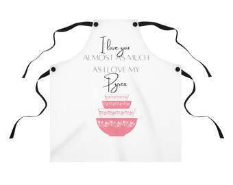 May include: White apron with black straps and a pink and white Pyrex bowl design. The text on the apron reads "I love you almost as much as I love my Pyrex."