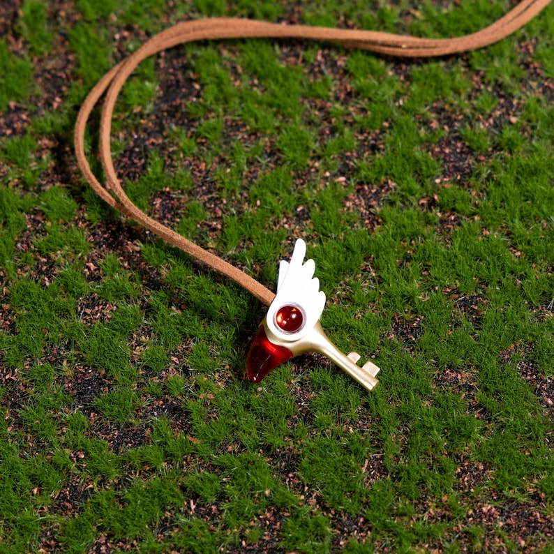 Unique bird head key necklace for anime collectors, featuring a lightweight 60g design and durable alloy craftsmanship, ideal for adding a magical girl touch to any cosplay or casual outfit.