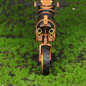 Side profile shot of the Master Cycle Zero motorcycle from Breath of the Wild, recreated as a 3D printed collectible. This image emphasizes the sleek lines, balanced proportions, and functional details like the wheels and suspension system. It’s a top-tier gift idea for Nintendo gamers, Zelda collectors, or fans looking to enhance their game-themed decor with unique, handmade items that bring the world of Hyrule into real life.