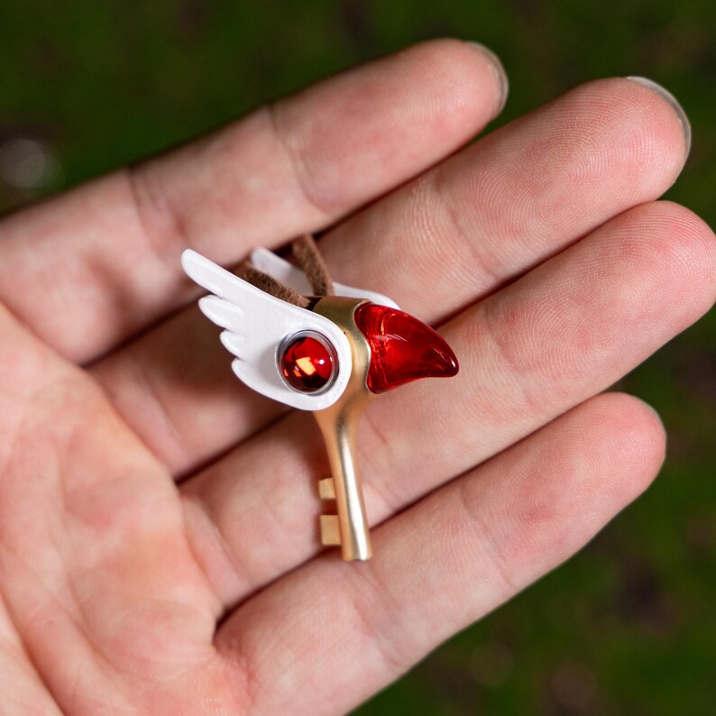 Magical girl necklace inspired by the Cardcaptor Sakura anime series, featuring an intricate bird head key design in durable PLA and alloy, perfect for cosplay, casual wear, or as a gift for anime fans.