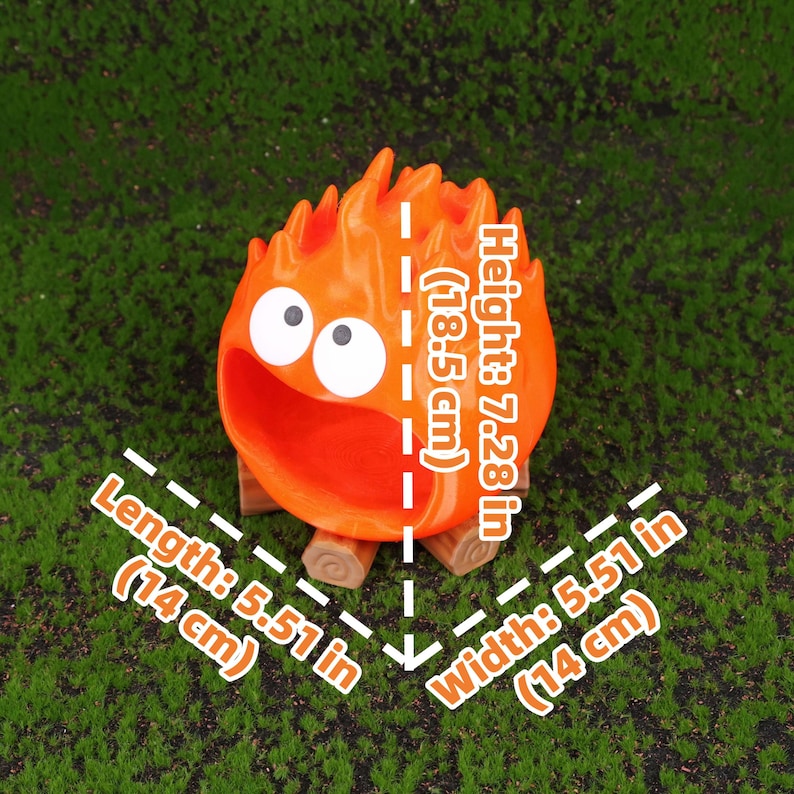 Close-up image of the Fire Demon Calcifer 3D printed storage box showing detailed craftsmanship, smooth surface finish, and the vibrant orange color. Designed as a functional desktop organizer, the product offers a practical yet fun solution to storing small office essentials. Inspired by Howl’s Moving Castle, it makes an excellent collectible item or anime-themed gift for birthdays, holidays, or special occasions.