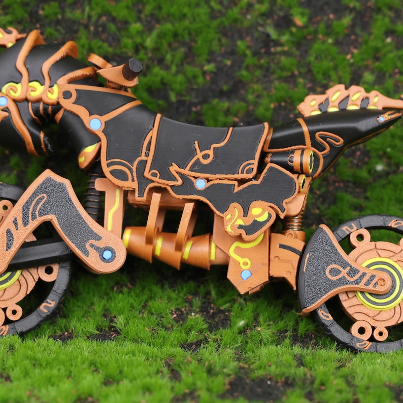 Front-facing view of the 3D printed Zelda BOTW Master Cycle Zero model, showcasing its futuristic mechanical design and sturdy construction. This detailed replica combines artistic craftsmanship with game-accurate features, including working front suspension and a color palette true to the original in-game design. Ideal for collectors who love high-quality video game memorabilia and immersive decor pieces that pay homage to their favorite franchises.