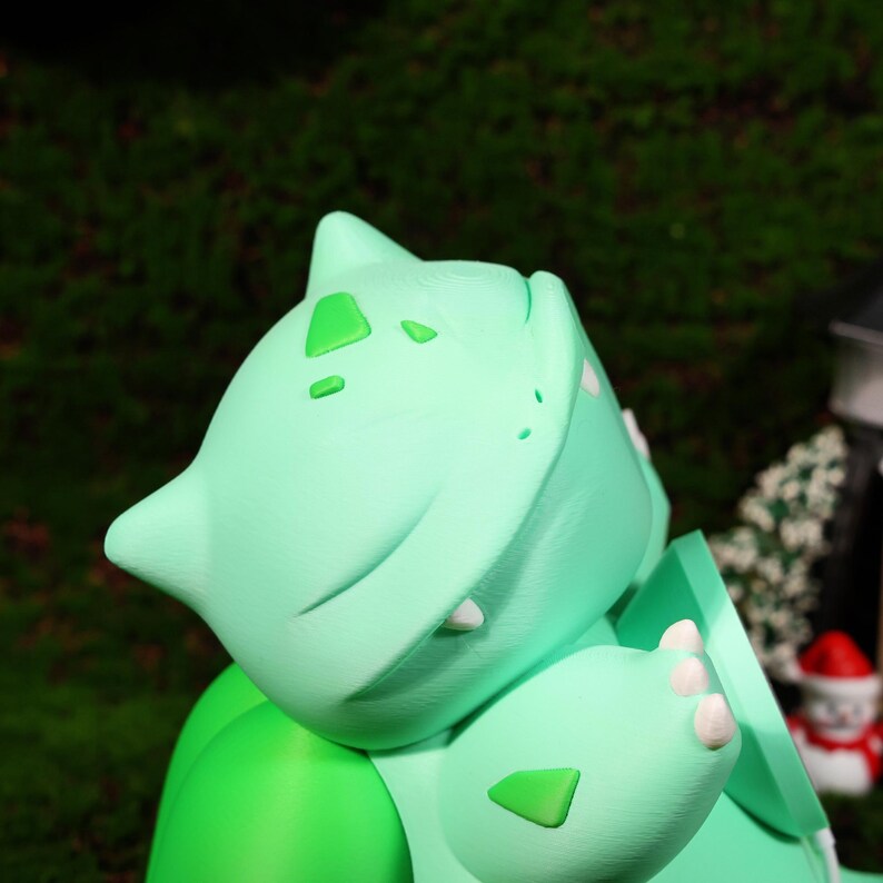 Whimsical charger stand with a cute plant creature design, perfect for gaming fans and collectors. Functional as both a phone stand and charger, making it ideal for those who appreciate quirky, nature-inspired décor and fast charging