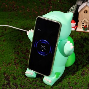 Plant creature charging station designed for Pokémon lovers and fantasy fans. Perfect for those who appreciate unique charging stations and whimsical home décor. MagSafe compatible for quick, efficient charging while showcasing your fandom.