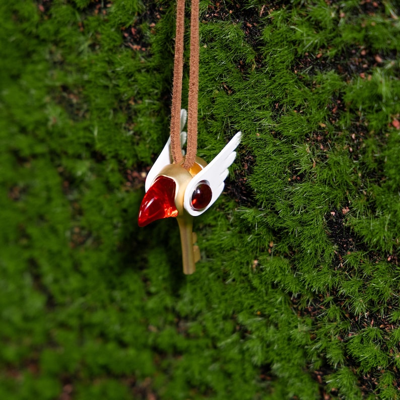 Exquisite magical girl jewelry with a detailed bird head key charm from Cardcaptor Sakura, made from PLA and alloy for a durable, long-lasting necklace perfect for anime lovers and cosplay accessories.