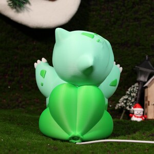 Whimsical charging stand featuring a plant-themed character, ideal for gamers, collectors, and fantasy décor lovers. Perfect for adding a playful yet functional touch to your workspace, nightstand, or gaming setup, with fast charging capabilities.