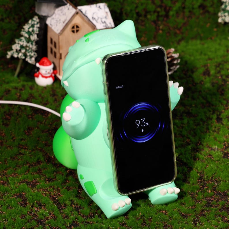 Cute plant creature MagSafe charger and phone stand, featuring a whimsical design inspired by nature. Ideal for fantasy creature fans and collectors. Perfect for charging and holding your phone while adding charm to any desk or nightstand.