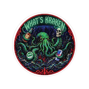 May include: Round sticker with a detailed illustration of an octopus with green tentacles, holding a bottle of rum, a can of Red Bull, and a ZYN pouch. The text "WHAT'S KRAKEN" is at the top, with a skull on the right.