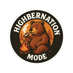 May include: A round sticker with a brown bear smoking a cigarette, sitting in front of a campfire. The sticker has the words "HIGHBERNATION MODE" in white text around the bear. The background is orange with pine trees.