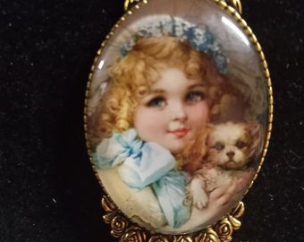 Little Darla and her puppy in gold like setting..