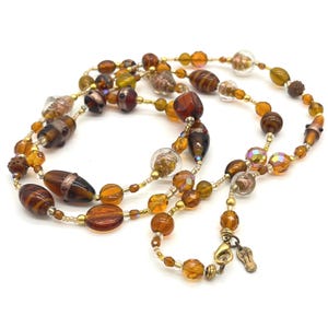 Shane Boyner Amber Tortoise Glass Bead Long Statement Necklace 40 Inch Gold Tone
