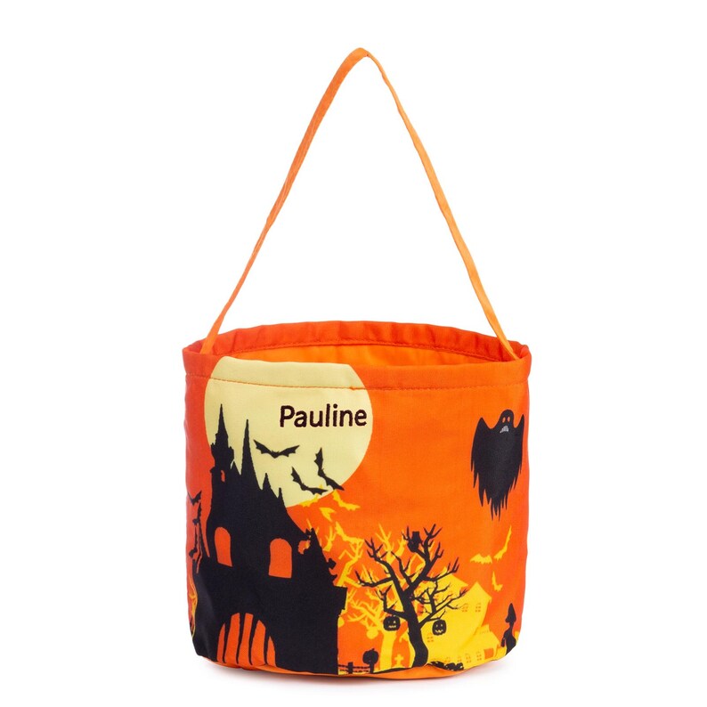 May include: Orange Halloween bucket with a black haunted house, bats, and ghost design. The bag has an orange handle and the name "Pauline" printed on the front.