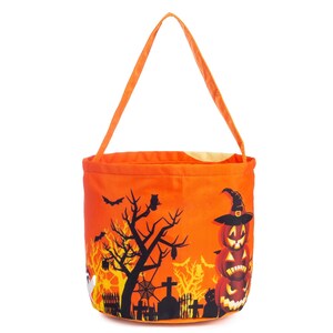 May include: Orange Halloween trick-or-treat bag with a handle. The bag features a spooky scene with a tree, bats, a ghost, and stacked jack-o'-lanterns wearing a witch's hat. The bag is made of fabric and has a simple design.