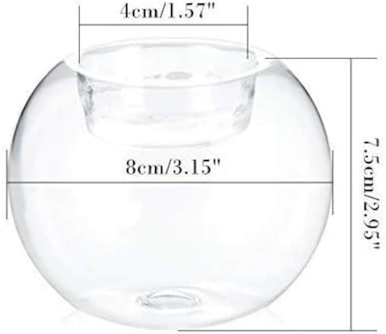 May include: A clear glass candle holder with a spherical shape. The holder has a diameter of 3.15 inches (8cm) and a height of 2.95 inches (7.5cm). The opening for the candle is 1.57 inches (4cm) wide. Ideal for home decor and events.
